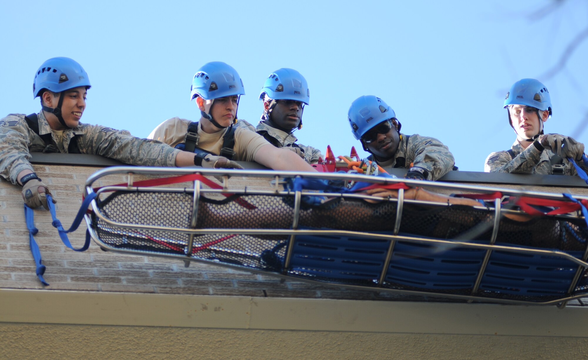 Senior Airman Aaron White, 81st Infrastructure Division firefighter, ties into his main line during rescue operations training Feb. 3, 2015, at Keesler Air Force Base, Miss.  The one-time advanced rescue certification training course consisted of confined space, high and low angle rescue and stokes basket rescue operations.  Eleven students from four bases completed the course.  (U.S. Air Force photo by Kemberly Groue)