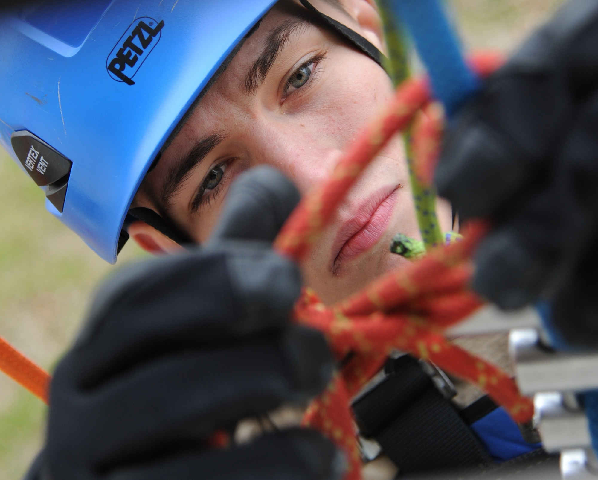 Senior Airman Aaron White, 81st Infrastructure Division firefighter, ties into his main line during rescue operations training Feb. 3, 2015, at Keesler Air Force Base, Miss.  The one-time advanced rescue certification training course consisted of confined space, high and low angle rescue and stokes basket rescue operations.  Eleven students from four bases completed the course.  (U.S. Air Force photo by Kemberly Groue)