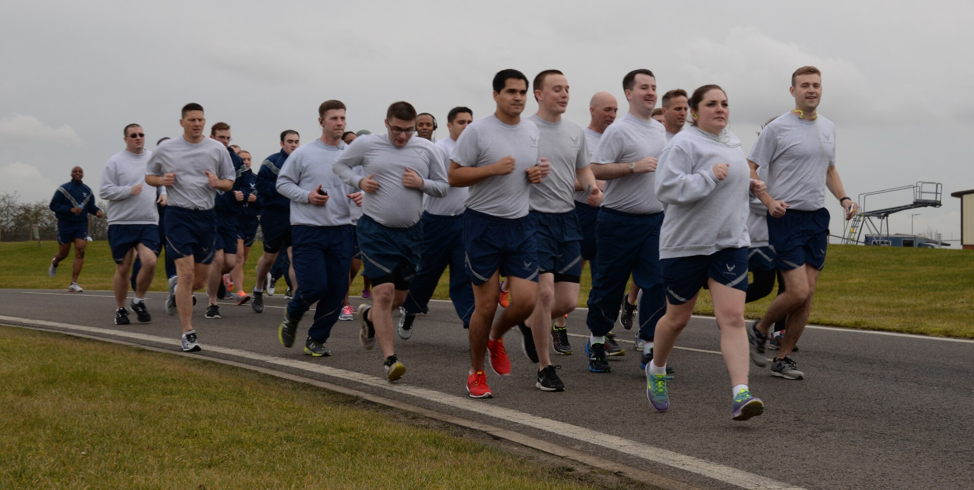 Team Mildenhall members power through a wing run Feb. 20, 2015, on RAF Mildenhall, England. Each month, members of Team Mildenhall gather together to run 5 km to encourage morale and camaraderie throughout the base through exercise and healthy competition. (U.S. Air Force photo by Airman 1st Class Jonathan Light/Released) 