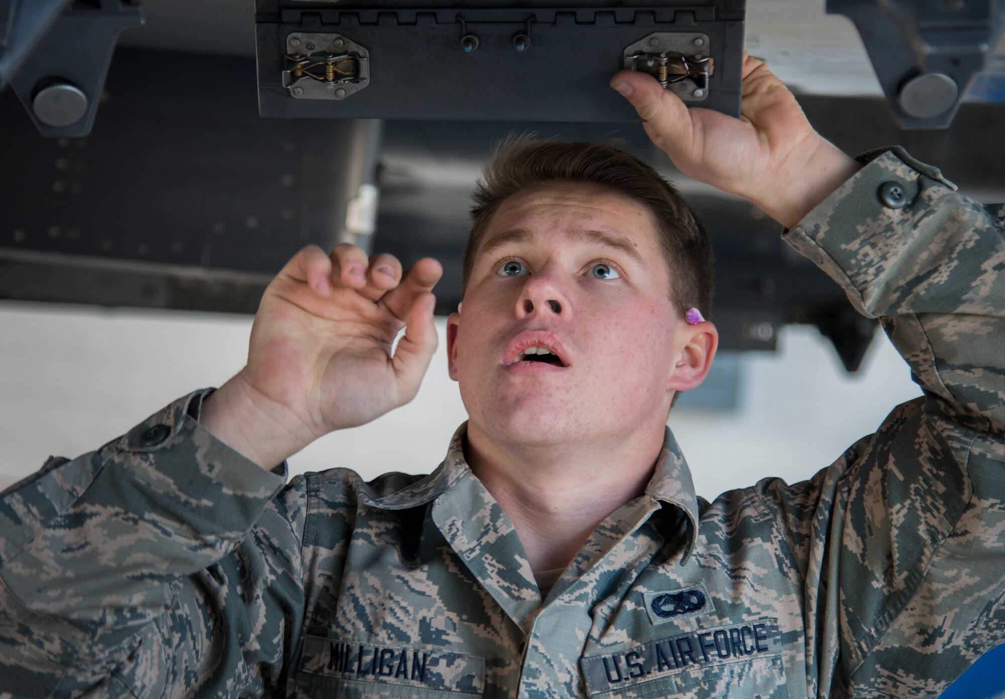 Airman 1st Class Vadim Milligan, 96th Aircraft Maintenance Squadron, performs preload checks on an F-15 Eagle during the annual weapons load crew of the year competition Feb. 13 at Eglin Air Force Base, Fla.  Two F-16 Fighting Falcon and two F-15 teams loaded five weapons on their respective aircraft for the rights to be the load crew of the year for 2014.  The timed competition is judged on safety, speed and accuracy.  The winner of the competition will be announced at the 96th Maintenance Group’s annual awards banquet in March.  (U.S. Air Force photo/Tech. Sgt. Jasmin Taylor)