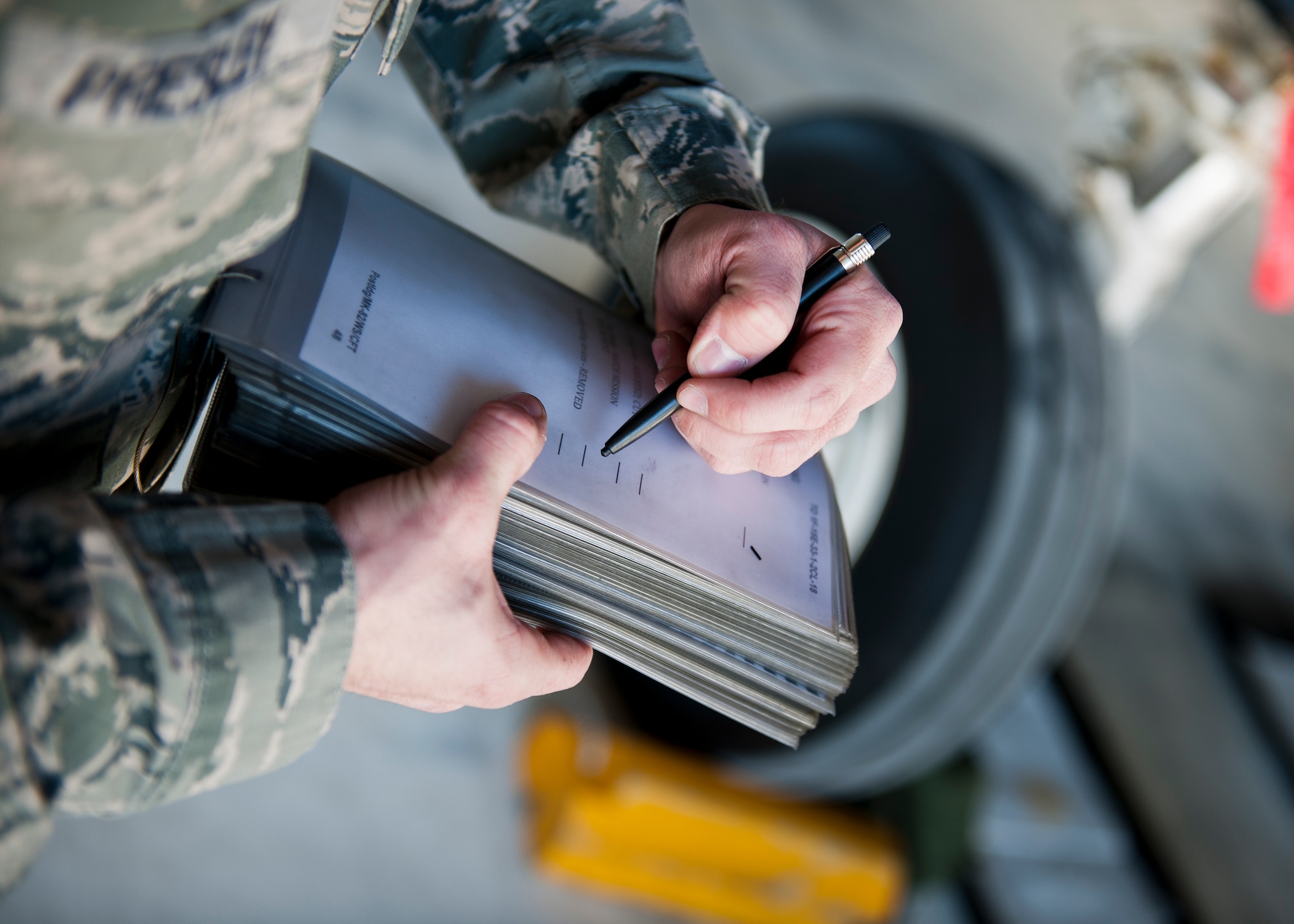 Staff Sgt. Stephen Presley, 96th Aircraft Maintenance Squadron, marks on his checklist after completing a task during the annual weapons load crew of the year competition Feb. 13 at Eglin Air Force Base, Fla.  Two F-16 Fighting Falcon and two F-15 teams loaded five weapons on their respective aircraft for the rights to be the load crew of the year for 2014.  The timed competition is judged on safety, speed and accuracy.  The winner of the competition will be announced at the 96th Maintenance Group’s annual awards banquet in March.  (U.S. Air Force photo/Samuel King Jr.)