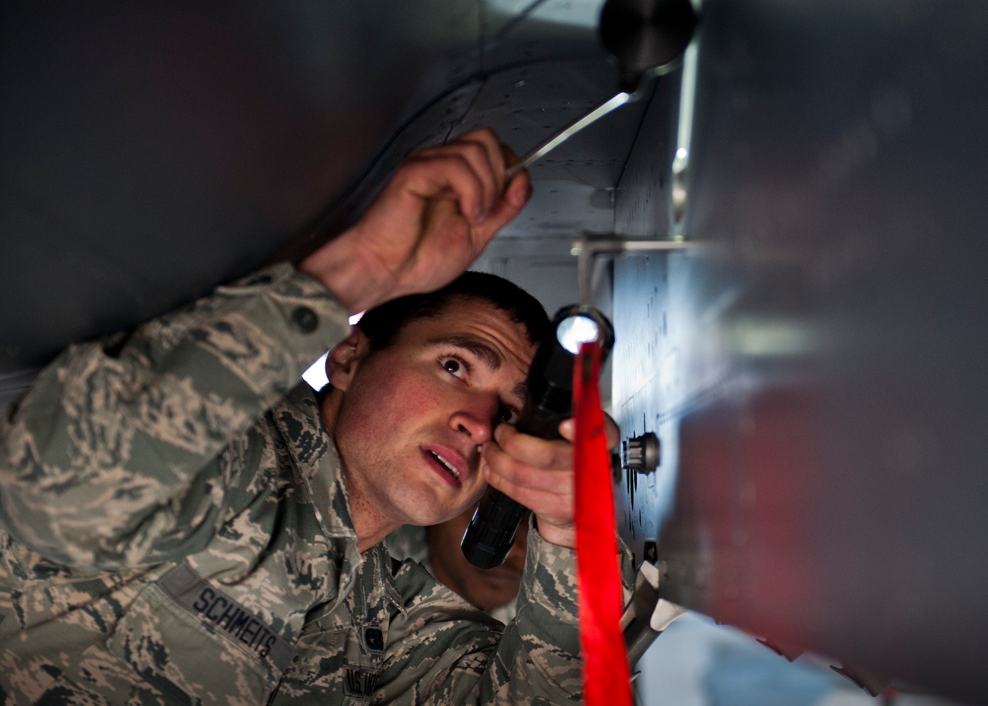 Airman 1st Class James Schmeits, 96th Aircraft Maintenance Squadron, performs preload checks on an F-15 Eagle during the annual weapons load crew of the year competition Feb. 13 at Eglin Air Force Base, Fla.  Two F-16 Fighting Falcon and two F-15 teams loaded five weapons on their respective aircraft for the rights to be the load crew of the year for 2014.  The timed competition is judged on safety, speed and accuracy.  The winner of the competition will be announced at the 96th Maintenance Group’s annual awards banquet in March.  (U.S. Air Force photo/Samuel King Jr.)