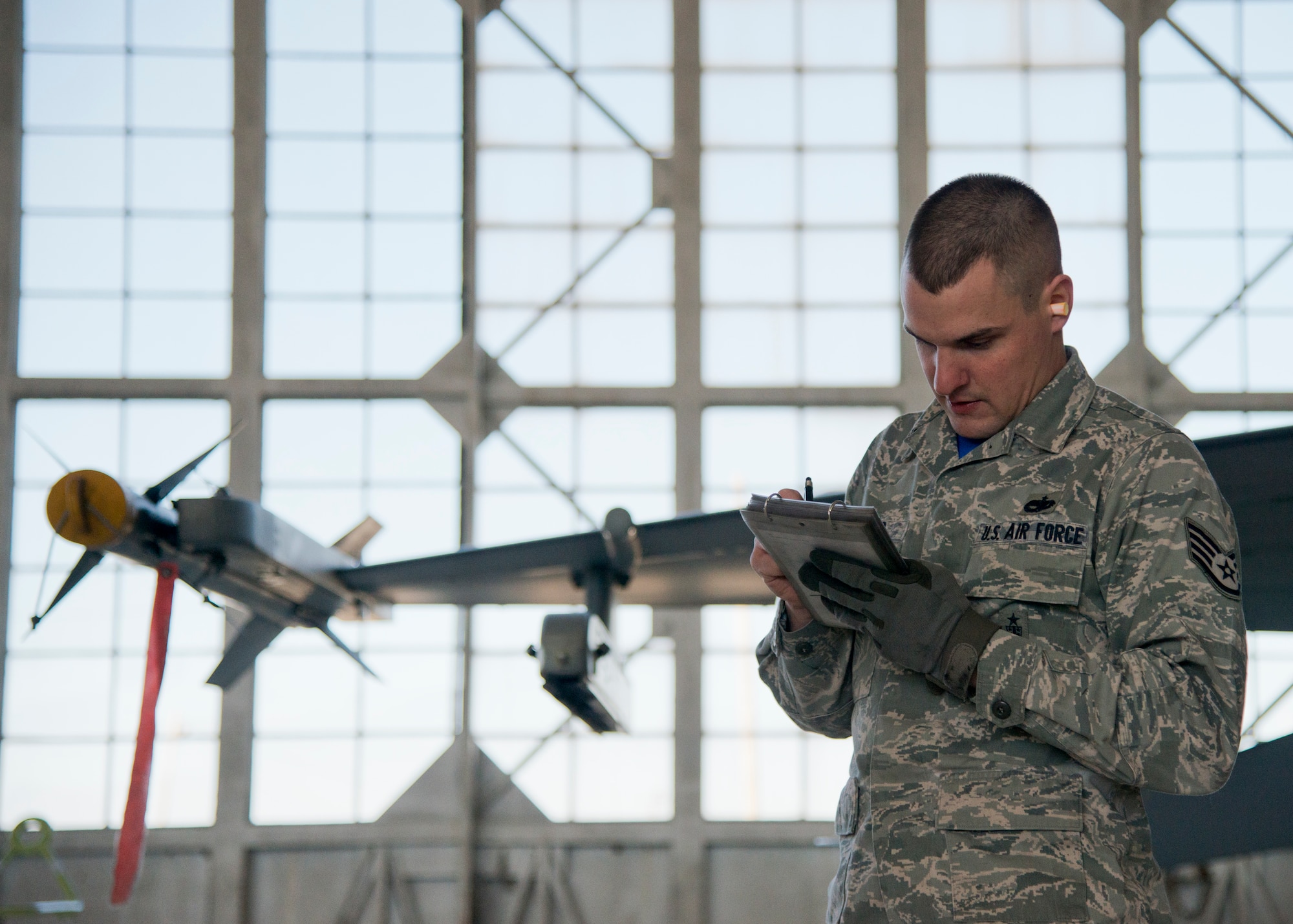 Staff Sgt. Brandon Oliver, 96th Aircraft Maintenance Squadron, reviews his F-16 Fighting Falcon checklist during the annual weapons load crew of the year competition Feb. 13 at Eglin Air Force Base, Fla.  Two F-16 and two F-15 Eagle teams loaded five weapons on their respective aircraft for the rights to be the load crew of the year for 2014.  The timed competition is judged on safety, speed and accuracy.  The winner of the competition will be announced at the 96th Maintenance Group’s annual awards banquet in March.  (U.S. Air Force photo/Tech. Sgt. Jasmin Taylor)