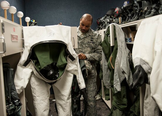 Tech Sgt. Elijah Gantt, of the 96th Operations Support Squadron, collects anti-exposure suits for inspection from the 40th Flight Test Squadron on Eglin Air Force Base, Fla., Feb. 9.  The anti-exposure suits are inspected by Aircrew Flight Equipment technicians every 180 days and leak tested every 365 days.  The suits are worn when water temperatures fall below 60 degrees and provide flight crews protection from extreme water temperatures, and increase survivability rates in the event of an in-flight emergency.  (U.S. Air Force photo/Ilka Cole)