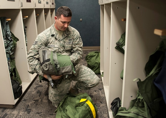 Staff Sgt. Steven Runion, of the 96th Operations Support Squadron, gathers flight equipment due for inspection at the 40th Flight Test Squadron on Eglin Air Force Base, Fla., Feb. 9.  The Aircrew Flight Equipment technicians maintain three shops at Eglin, a shop at Duke Field and a shop at Hurlburt Field.  The AFE shop supports aircrews and equipment for the F-15, F-16, A-10, CV-22, C-130 and the UH-1.  The equipment maintained ranges from oxygen connectors to complex targeting systems.  (U.S. Air Force Photo/Ilka Cole)
