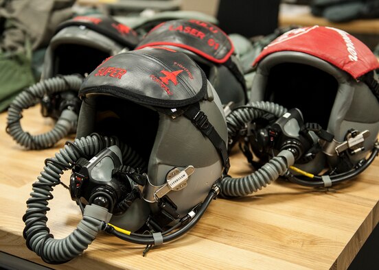 Fighter pilot helmets await inspection at the Aircrew Flight Equipment facility on Eglin Air Force Base, Fla., Feb. 9.  AFE technicians perform pre and post flight inspections of the helmets.  The fighter pilot helmets are also inspected on a 30-day cycle to ensure every component is working properly.  The maintenance of the helmets is critical to the pilot’s safety, communication capabilities and oxygen supply.  (U.S. Air Force photo/Ilka Cole)