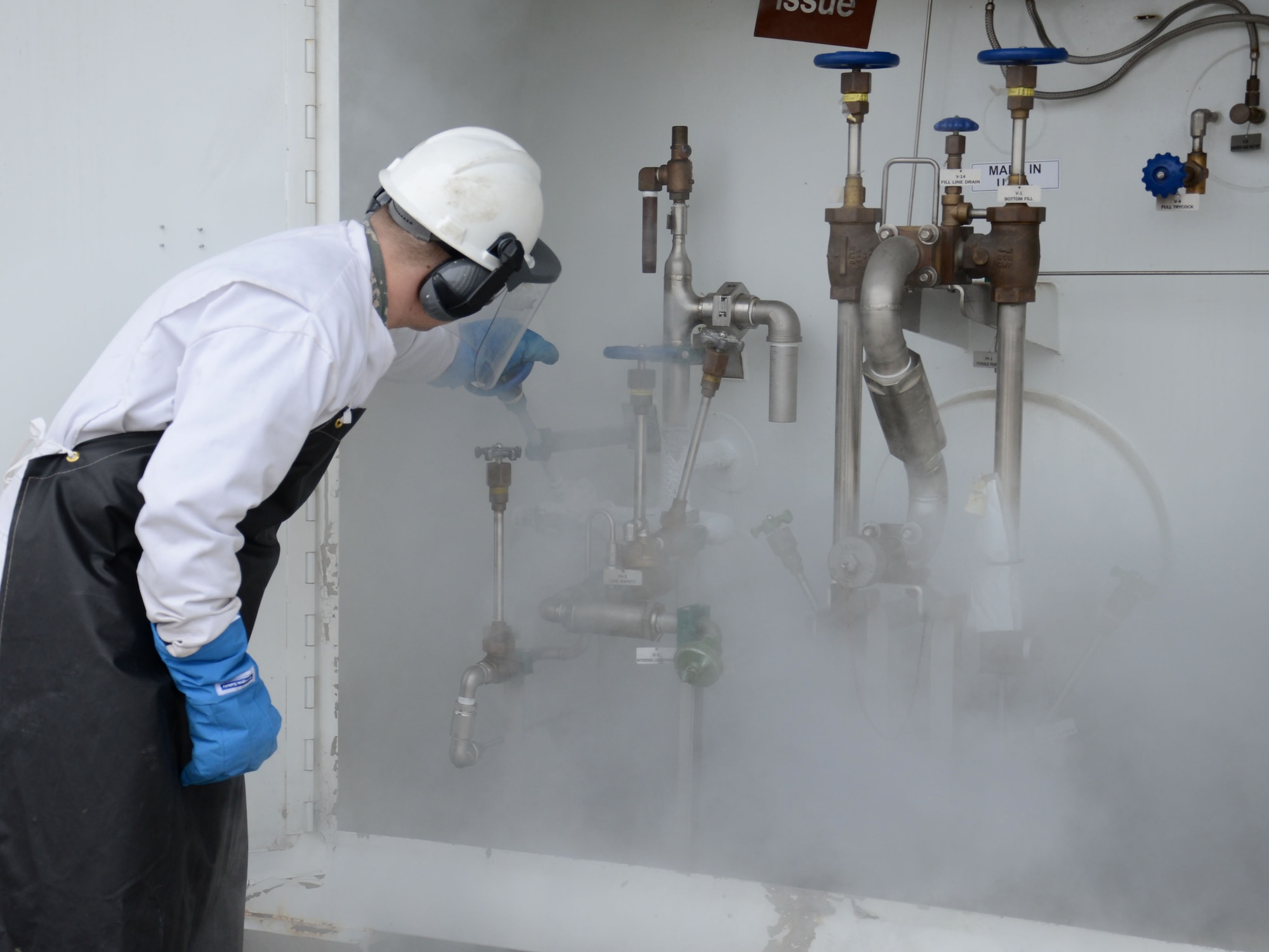 U.S. Air Force Senior Airman Matthew Dillard, 100th Logistics Readiness Squadron cryogenic specialist from Las Vegas, Nev., drains pressure from a liquid oxygen storage tank Feb. 11, 2015, on RAF Mildenhall, England. It’s vital that the pressure is drained as the temperature in the tank reaches -297 degrees Fahrenheit and too much pressure could result in safety concerns. (U.S. Air Force photo by Gina Randall/Released)