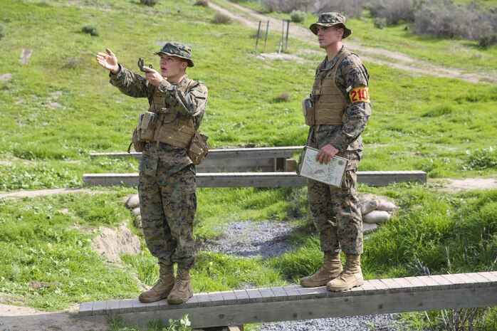 Recruits Jacob R. Kottman and Chainey L. Ellis, (right to left) Platoon 2105, Echo Company, 2nd Recruit Training Battalion, confirm they’re going the correct direction during the Land Navigation Course at Edson Range, Marine Corps Base Camp Pendleton, Calif., Jan. 22.  Recruits will use these skills taught when they continue their training at the School of Infantry.