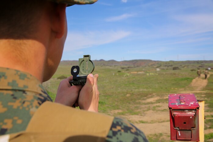 Recruit Chainey L. Ellis, Platoon 2105, Echo Company, 2nd Recruit Training Battalion, uses his compass to navigate to the next mark during the Land Navigation Course at Edson Range, Marine Corps Base Camp Pendleton, Calif., Jan. 22.  Recruits will use these skills taught when they continue their training at the School of Infantry.