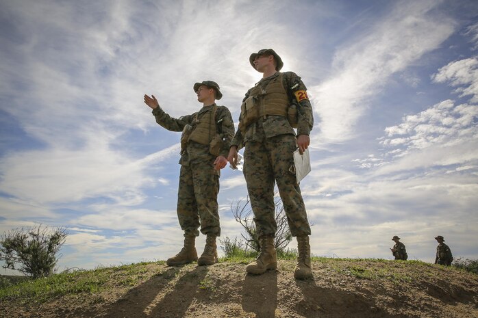 Recruits Jacob R. Kottman and Chainey L. Ellis, (right to left) Platoon 2105, Echo Company, 2nd Recruit Training Battalion, determine the direction to their mark during the Land Navigation Course at Edson Range, Marine Corps Base Camp Pendleton, Calif., Jan. 22.  Kottman is a Topeka, Kan., native who was recruited out of Recruiting Station Kansas City, Mo.  Ellis is a Nevada, Mo., native who was recruited out of Recruiting Station Kansas City, Mo.