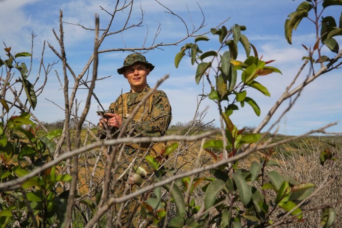Recruit Chainey L. Ellis, Platoon 2105, Echo Company, 2nd Recruit Training Battalion, uses his compass to confirm the direction to the next mark during the Land Navigation Course at Edson Range, Marine Corps Base Camp Pendleton, Calif., Jan. 22.  Ellis is a Nevada, Mo., native who was recruited out of Recruiting Station Kansas City, Mo.