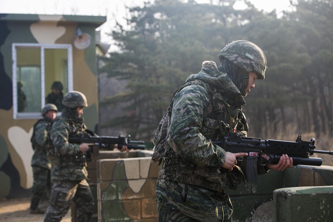 Republic of Korea Marines fire rounds from a Daewoo K201 40mm grenade launcher Feb. 5 at a mountainside during Korean Marine Exchange Program 15-3 at Gimpo, Republic of Korea. After this demonstration, the ROK Marines began to teach U.S. Marines the different characteristics of the weapon and how to properly use it. The U.S. Marines are reconnaissance men with Alpha Company, 3rd Reconnaissance Battalion, 3rd Marine Division, III Marine Expeditionary Force. The ROK Marines are with 2nd Battalion, 2nd Marine Division. 