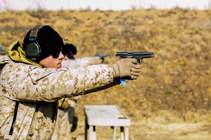 U.S. Marine Cpl. David A. Range fires rounds from a Daewoo K5 handgun into a target Feb. 5 during Korean Marine Exchange Program 15-3 at Gimpo, Republic of Korea. The U.S. Marines were given the unique opportunity to also test out the Daewoo K2 assault rifle, Daewoo K1 submachine gun, the K201 40mm grenade launcher and the Daewoo K14 sniper rifle. Range, from Arlington, Texas, is a reconnaissance man with Alpha Company, 3rd Reconnaissance Battalion, 3rd Marine Division, III Marine Expeditionary Force. 