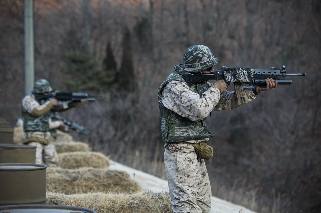 U.S. Marines shoot downrange from the standing and kneeling firing positions Feb. 5 during Korean Marine Exchange Program 15-3 at Gimpo, Republic of Korea. The weapon they are using is the Daewoo K2 assault rifle. The U.S. Marines were given the unique opportunity to also test out the Daewoo K1 submachine gun, Daewoo K5 handgun, the K201 40mm grenade launcher and the Daewoo K14 sniper rifle. The U.S. Marines are reconnaissance men with Alpha Company, 3rd Reconnaissance Battalion, 3rd Marine Division, III Marine Expeditionary Force. 