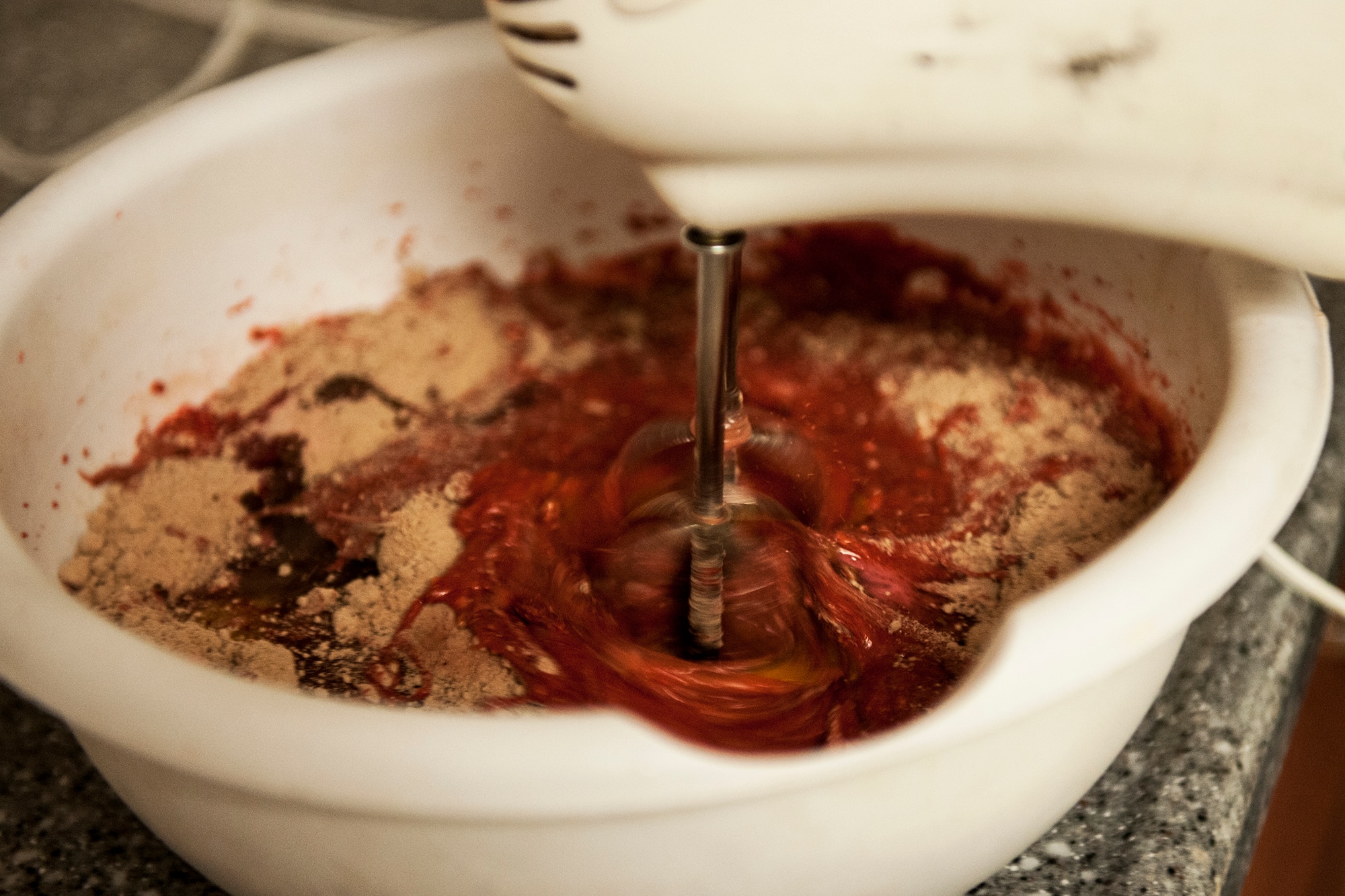 Staff Sgt. Lawyer Evans, 8th Logistics Readiness Squadron supply technician assistant NCO in charge, also known as “Cake Boss,” mixes red velvet cake ingredients Feb. 17, 2015, at Kunsan Air Base, Republic of Korea. Evans started baking cakes in 2005 when he was stationed at Joint Base Pearl Harbor–Hickam, Hawaii. (U.S. Air Force photo by Senior Airman Katrina Heikkinen/Released)