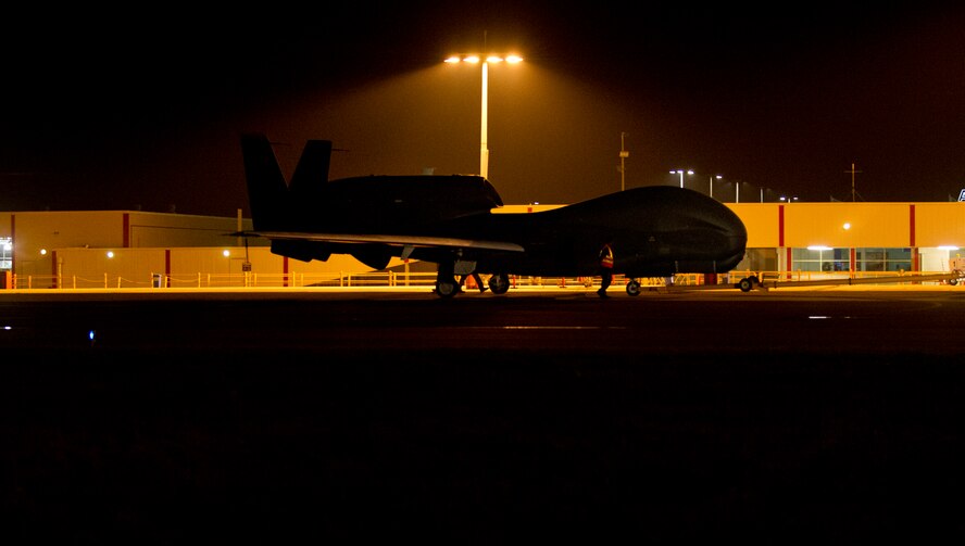 An RQ-4 Global Hawk assigned to the 69th Reconnaissance Group, Andersen Air Force Base, Guam, is towed down the taxiway at Avalon Airport, Victoria, Australia, Feb. 21, 2015. Approximately 100 U.S. personnel will showcase U.S. military aircraft, including the Air Force's F-22 Raptor, F-16 Fighting Falcon, RQ-4 Global Hawk, B-52 Stratofortress, and KC-135 Stratotanker and the Navy's P-8A Poseidon at the airshow. (U.S. Air Force photo/Staff Sgt. Sheila deVera) 