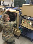 Marines of AEEEST 1-15 work on the Integrated Trailer Environmental Control Unit and Generator.