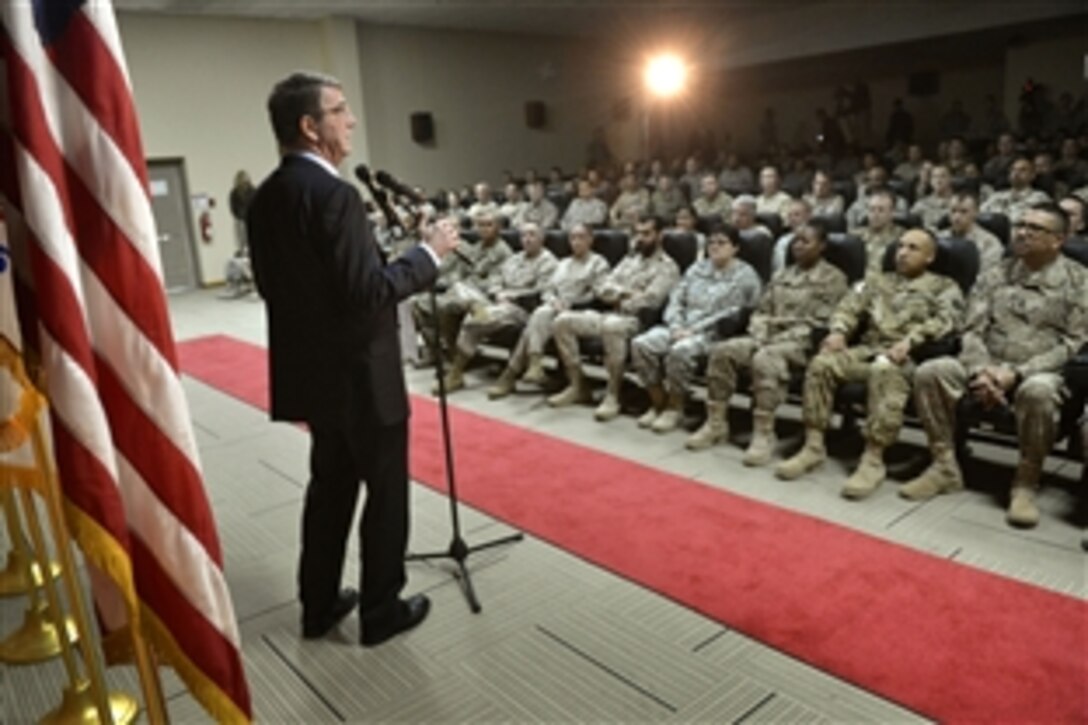 U.S. Defense Secretary  Ash Carter delivers remarks at a troop event on Camp Arifjan, Kuwait, Feb. 23, 2015. 