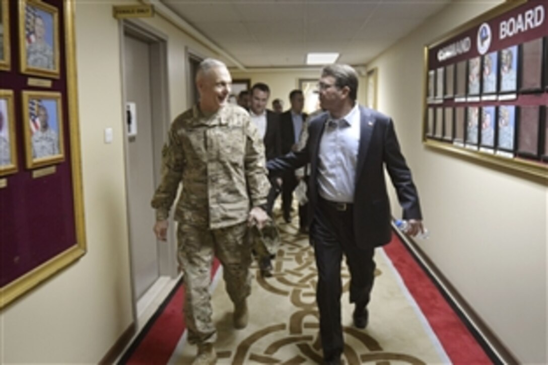 U.S. Defense Secretary Ash Carter thanks U.S. Army Lt. Gen. James L. Terry, commanding general of U.S. Army Central, after a regional security conference on Camp Arifjan, Kuwait, Feb. 23, 2015.