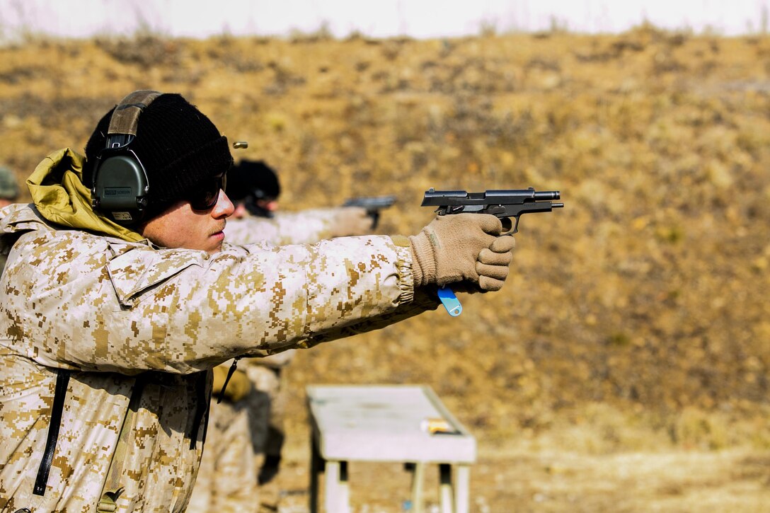 U.S. Marine Cpl. David A. Range fires rounds from a Daewoo K5 handgun into a target Feb. 5 during Korean Marine Exchange Program 15-3 at Gimpo, Republic of Korea. The U.S. Marines were given the unique opportunity to also test out the Daewoo K2 assault rifle, Daewoo K1 submachine gun, the K201 40mm grenade launcher and the Daewoo K14 sniper rifle. Range, from Arlington, Texas, is a reconnaissance man with Alpha Company, 3rd Reconnaissance Battalion, 3rd Marine Division, III Marine Expeditionary Force. (U.S. Marine Corps photo by Cpl. Tyler S. Giguere/Released)