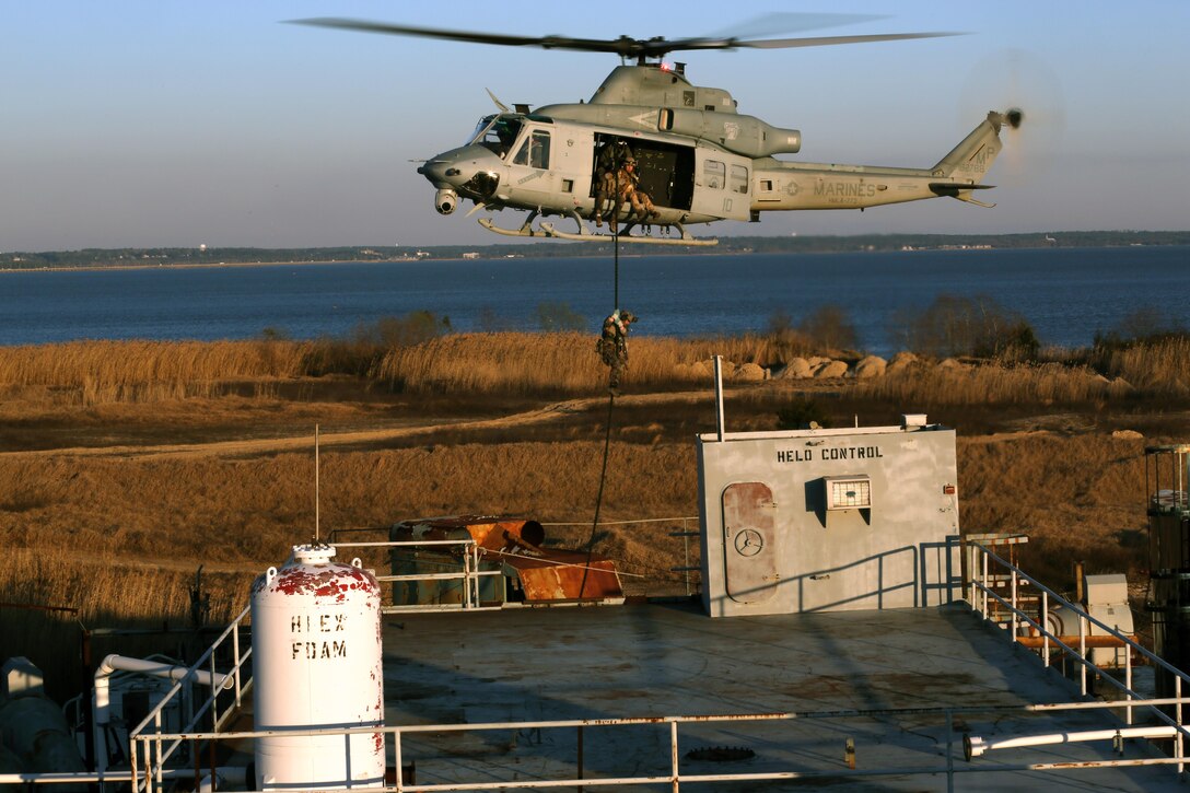 MOBILE, Ala.—A Critical Skills Operator with 3rd Marine Special Operations Battalion, U.S. Marine Corps Forces Special Operations Command, fast-ropes onto a ship here, Feb. 12, 2015. The battalion conducted a Visit, Board, Search and Seizure mission aboard the ship during RAVEN 15-03, a 10-day realistic military training exercise to enhance the battalion’s readiness for worldwide support to global security. (Official U.S. Marine Corps photo by GySgt. Josh Higgins/released)
