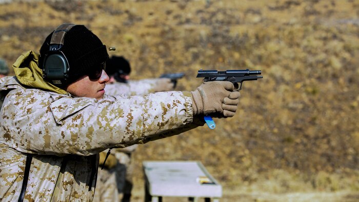 U.S. Marine Cpl. David A. Range fires rounds from a Daewoo K5 handgun into a target Feb. 5 during Korean Marine Exchange Program 15-3 at Gimpo, Republic of Korea. The U.S. Marines were given the unique opportunity to also test out the Daewoo K2 assault rifle, Daewoo K1 submachine gun, the K201 40mm grenade launcher and the Daewoo K14 sniper rifle. Range, from Arlington, Texas, is a reconnaissance man with Alpha Company, 3rd Reconnaissance Battalion, 3rd Marine Division, III Marine Expeditionary Force.