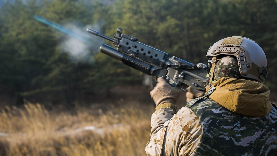 U.S. Marine Cpl. Richard J. Bennaugh fires training rounds from a Daewoo K201 grenade launcher Feb. 5 during Korean Marine Exchange Program 15-3 at Gimpo, Republic of Korea. The U.S. Marines fired six training rounds and then watched a live fire shoot demonstrated by Republic of Korea Marines. The U.S. Marines were given the unique opportunity to also test out the Daewoo K1 submachine gun, Daewoo K5 handgun, the Daewoo K2 assault rifle and the Daewoo K14 sniper rifle. Bennaugh, from Pittsburgh, Pennsylvania, is a reconnaissance man with Alpha Company, 3rd Reconnaissance Battalion, 3rd Marine Division, III Marine Expeditionary Force.