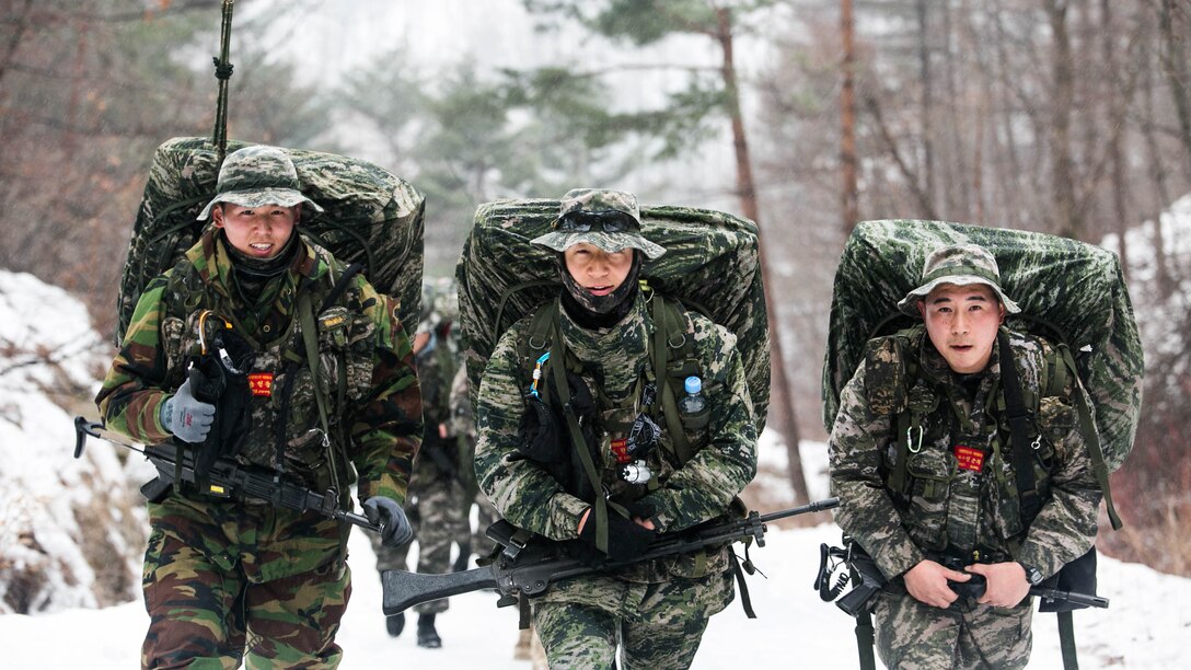 Republic of Korea Marines hike a 35- km path up a mountain Jan. 15 during Korean Marine Exchange Program 15-3 in Pyeongchang, Republic of Korea. The ROK Marines were training for mountain warfare and snow mobility warfare alongside their U.S. counterparts from Alpha Company, 3rd Reconnaissance Battalion, 3rd Marine Division, III Marine Expeditionary Force. The ROK Marines are force reconnaissance men with 2nd Battalion, 2nd Marine Division. 