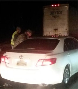 Soldiers from the Tennessee Army National Guard’s 267th Military Police Company check the welfare of a motorist stranded on Interstate 40 Friday night as a result of snow and ice storms that moved through the area. Soldiers from the unit patrolled more than 50 miles of highway during the worst of the storm assisting those who became stranded and bringing supplies to others. Soldiers from the Tennessee Army Guard are expected to remain on duty through Wednesday assisting local and state authorities with response to the storm.