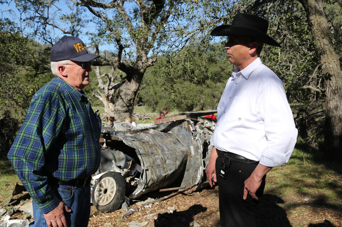 Robert Jones, left, former Navy pilot with then Attack Squadron (VA) 146, talks to Hank Rupp, right, chief operations officer and general counsel for the Rancho Guejito, during a visit to see Jones’ old FJ-4B Fury at Rancho Guejito in Escondido, Calif., Feb. 5. Jones’ visit was the first time he had seen the aircraft since ejected from it in 1957.