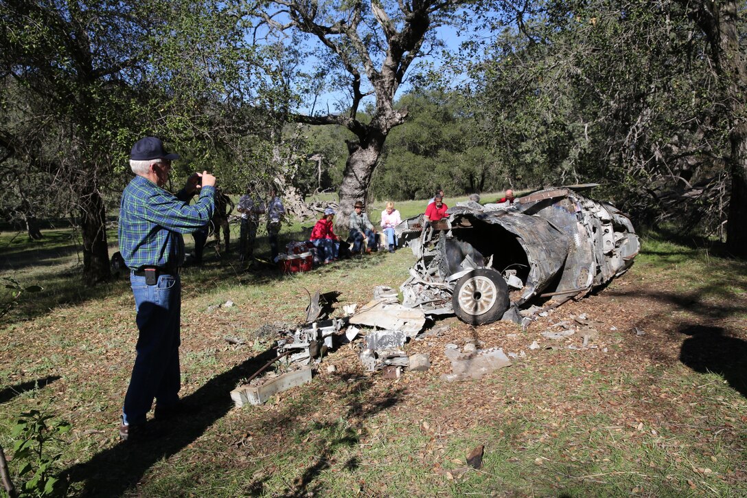 Robert Jones, former Navy pilot with then Attack Squadron (VA) 146, takes a picture of the wreckage of his FJ-4B Fury at Rancho Guejito in Escondido, Calif., Feb. 5. Jones ejected from the plane in 1957 with no knowledge of where it crashed until it was discovered at the ranch.