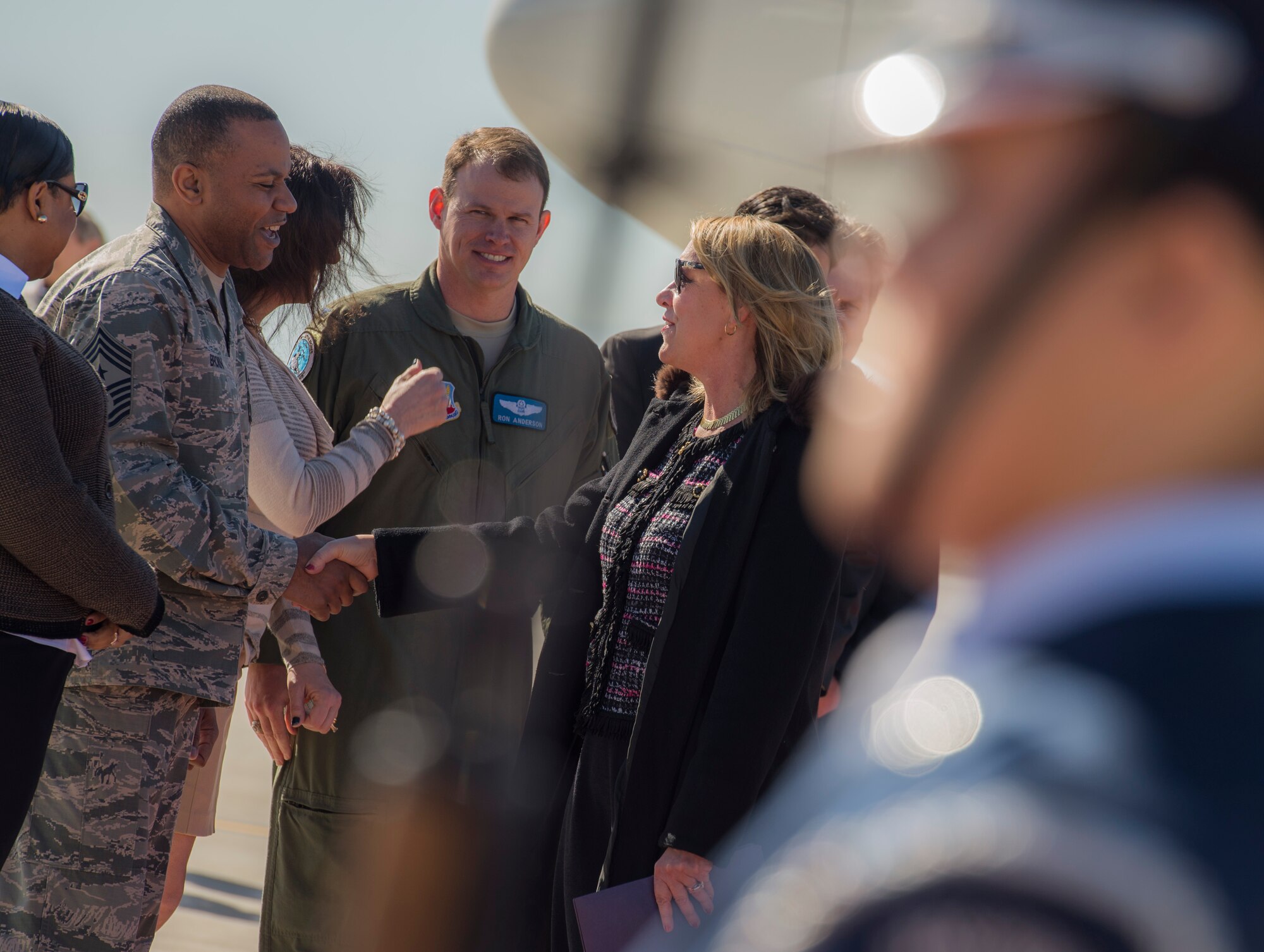 Secretary of the Air Force Deborah Lee James shakes hands with Chief Master Sgt. David Brown upon her arrival at Mountain Home Air Force Base, Idaho, Feb. 18, 2015. During her visit James was the guest speaker at the annual awards ceremony and spent time meeting with the Airmen who accomplish the mission every day. Brown is the 366th Fighter Wing command chief. (U.S. Air Force photo/Airman 1st Class Jessica H. Smith)