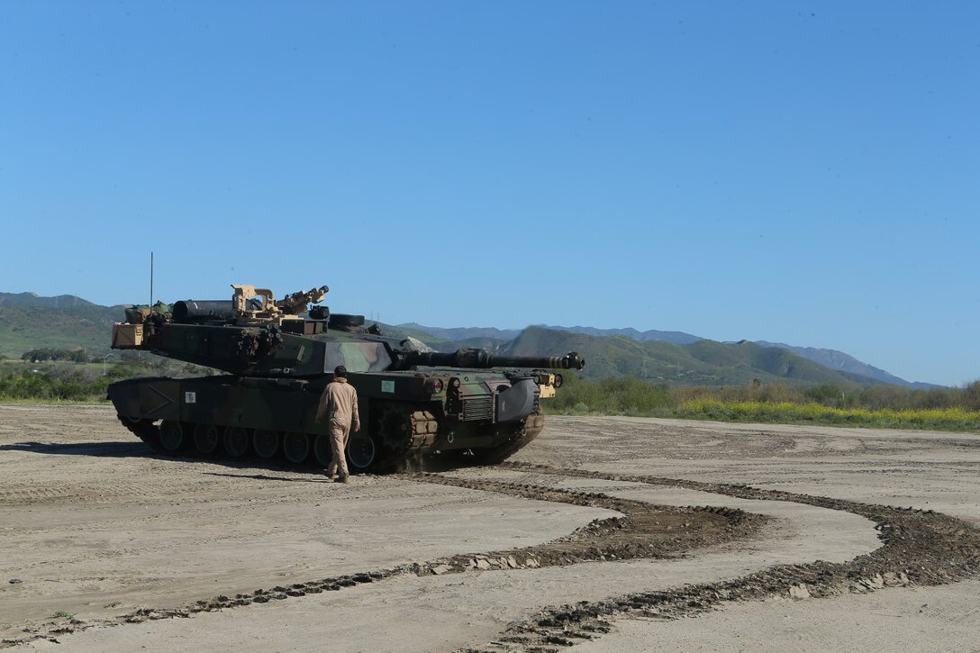 An M1A1 Abrams Main Battle Tank from 1st Tank Battalion detachment, Battalion Landing Team 2nd Battalion, 1st Marines, 11th Marine Expeditionary Unit (MEU), unloads on Red Beach during the 11th MEU's final offload, Feb. 24. The 11th MEU completed a Western Pacific deployment to the U.S. 5th and 7th Fleet areas of responsibility. (U.S. Marine Corps photo by Cpl. Jonathan R. Waldman/Released)