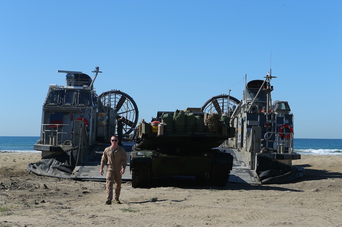 An M1A1 Abrams Main Battle Tank from 1st Tank Battalion detachment, Battalion Landing Team 2nd Battalion, 1st Marines, 11th Marine Expeditionary Unit (MEU), unloads from a landing craft air cushion with Assault Craft Unit 5 during the 11th MEU's final offload, Feb. 24. The 11th MEU completed a Western Pacific deployment to the U.S. 5th and 7th Fleet areas of responsibility. (U.S. Marine Corps photo by Cpl. Jonathan R. Waldman/Released)