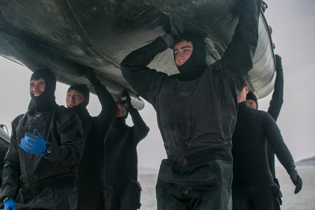 U.S. and Republic of Korea Marines carry a combat rubber raiding craft over their heads Feb. 5 during Korean Marine Exchange Program 15-3 in Gimpo, Gyeonggi Province, Republic of Korea. This type of carry is common when moving the craft over land or other terrain where it cannot operate. The U.S. Marines are reconnaissance men with Alpha Company, 3rd Reconnaissance Battalion, 3rd Marine Division, III Marine Expeditionary Force. The ROK Marines are force reconnaissance men with 2nd Battalion, 2nd Marine Division.