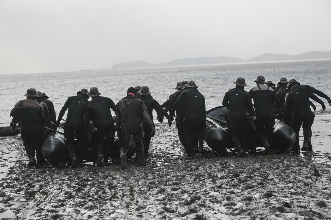 Republic of Korea Marines carry  combat rubber raiding crafts into the ocean Feb. 5 during Korean Marine Exchange Program 15-3 in Gimpo, Gyeonggi Province, Republic of Korea. The training was to prepare for stealth landings in a port. The ROK Marines trained alongside U.S. Marines during KMEP 15-3, familiarizing U.S. Marines with the Korean Peninsula while building upon an existing strong relationship between the two forces. The U.S. Marines are reconnaissance men with Alpha Company, 3rd Reconnaissance Battalion, 3rd Marine Division, III Marine Expeditionary Force. The ROK Marines are force reconnaissance men with 2nd Battalion, 2nd Marine Division.