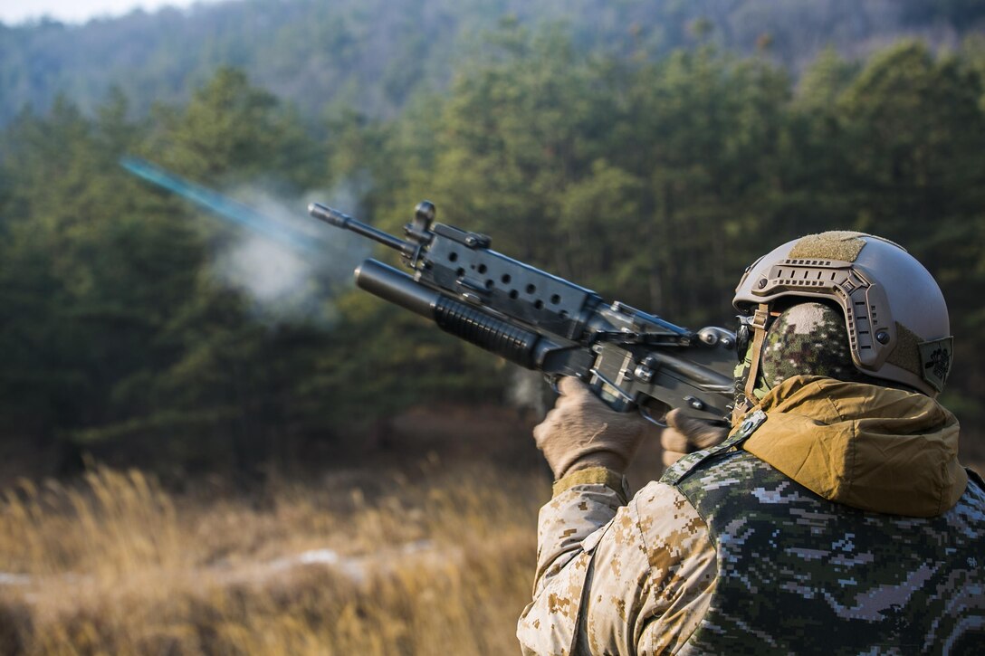 U.S. Marine Cpl. Richard J. Bennaugh fires training rounds from a Daewoo K201 grenade launcher Feb. 5 during Korean Marine Exchange Program 15-3 at Gimpo, Republic of Korea. The U.S. Marines fired six training rounds and then watched a live fire shoot demonstrated by Republic of Korea Marines. The U.S. Marines were given the unique opportunity to also test out the Daewoo K1 submachine gun, Daewoo K5 handgun, the Daewoo K2 assault rifle and the Daewoo K14 sniper rifle. Bennaugh, from Pittsburgh, Pennsylvania, is a reconnaissance man with Alpha Company, 3rd Reconnaissance Battalion, 3rd Marine Division, III Marine Expeditionary Force. 