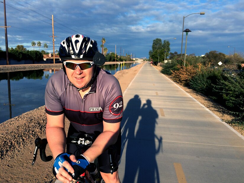 Tech. Sgt. Robert K. Smith, U.S. Air Force Band Max Impact percussionist, sits on his bike during a road cycling trip near Mesa, Ariz., Jan. 31, 2015. To help Max Impact become the fittest flight in the U.S. Air Force Band, Smith rides 150-300 miles week. (Courtesy photo / Master Sgt. David Foster)