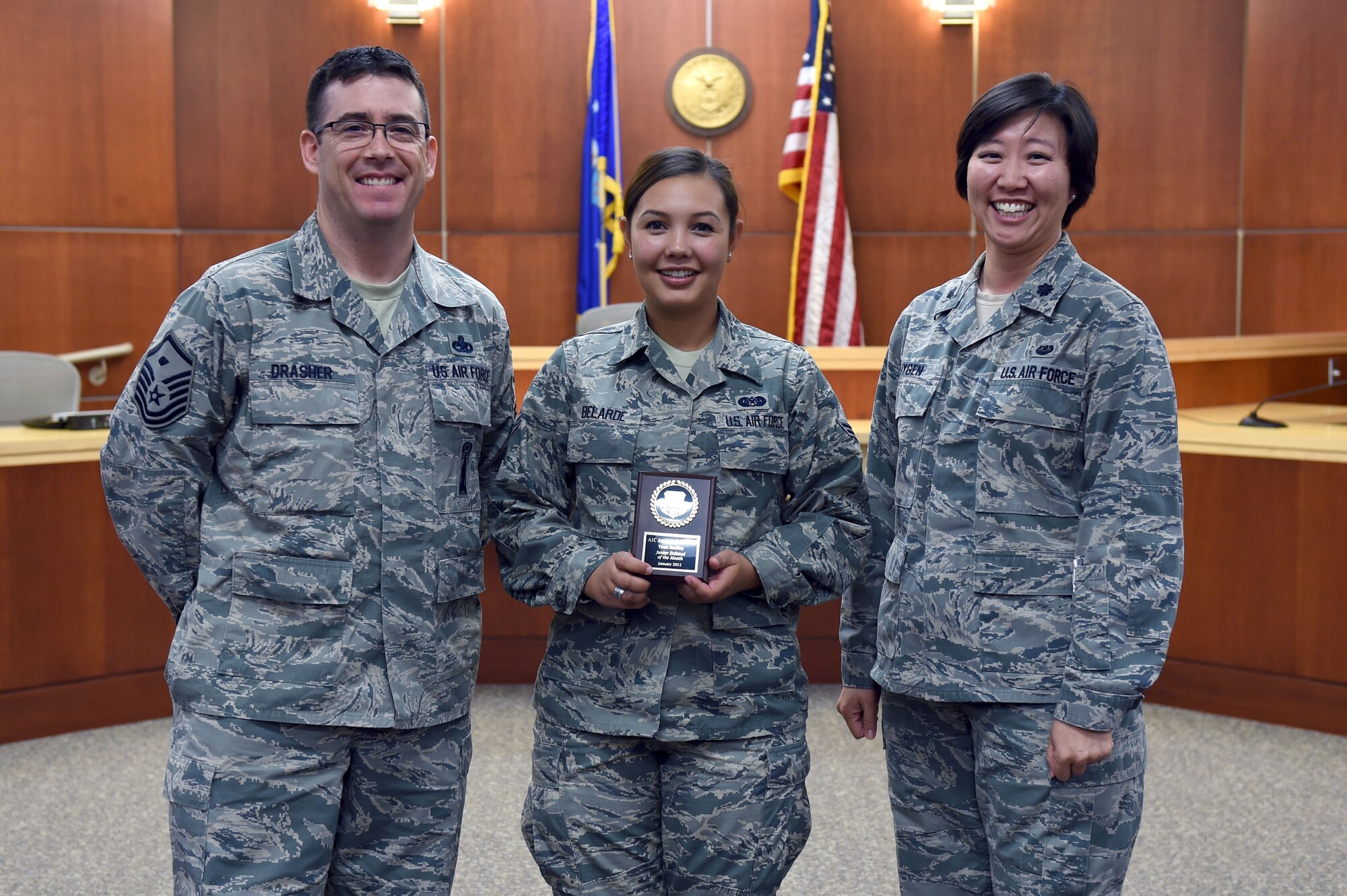 Airman 1st Class Amanda Belarde, 460th Space Wing Judge Advocate military justice paralegal, receives the February Junior Enlisted of the Month award Feb. 24, 2015, on Buckley Air Force Base, Colo. The JEoM award is given to the most deserving Airman who have not only shown hard work, leadership and dedication to their job, but also put forth significant effort into bettering themselves and the community. (U.S. Air Force photo by Airman 1st Class Emily E. Amyotte/Released)