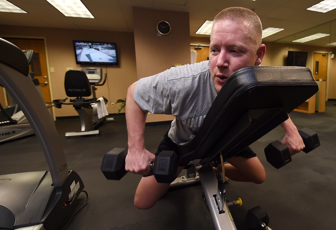 Master Sgt. Jonathan McPherson, U.S. Air Force Band Max Impact pianist, works out at the Holiday Inn Hotel and Suites gym in Mesa, Ariz., Jan. 31, 2015. Band members use team accountability to maintain their fitness while on the road. (U.S. Air Force photo/ Senior Airman Nesha Humes)