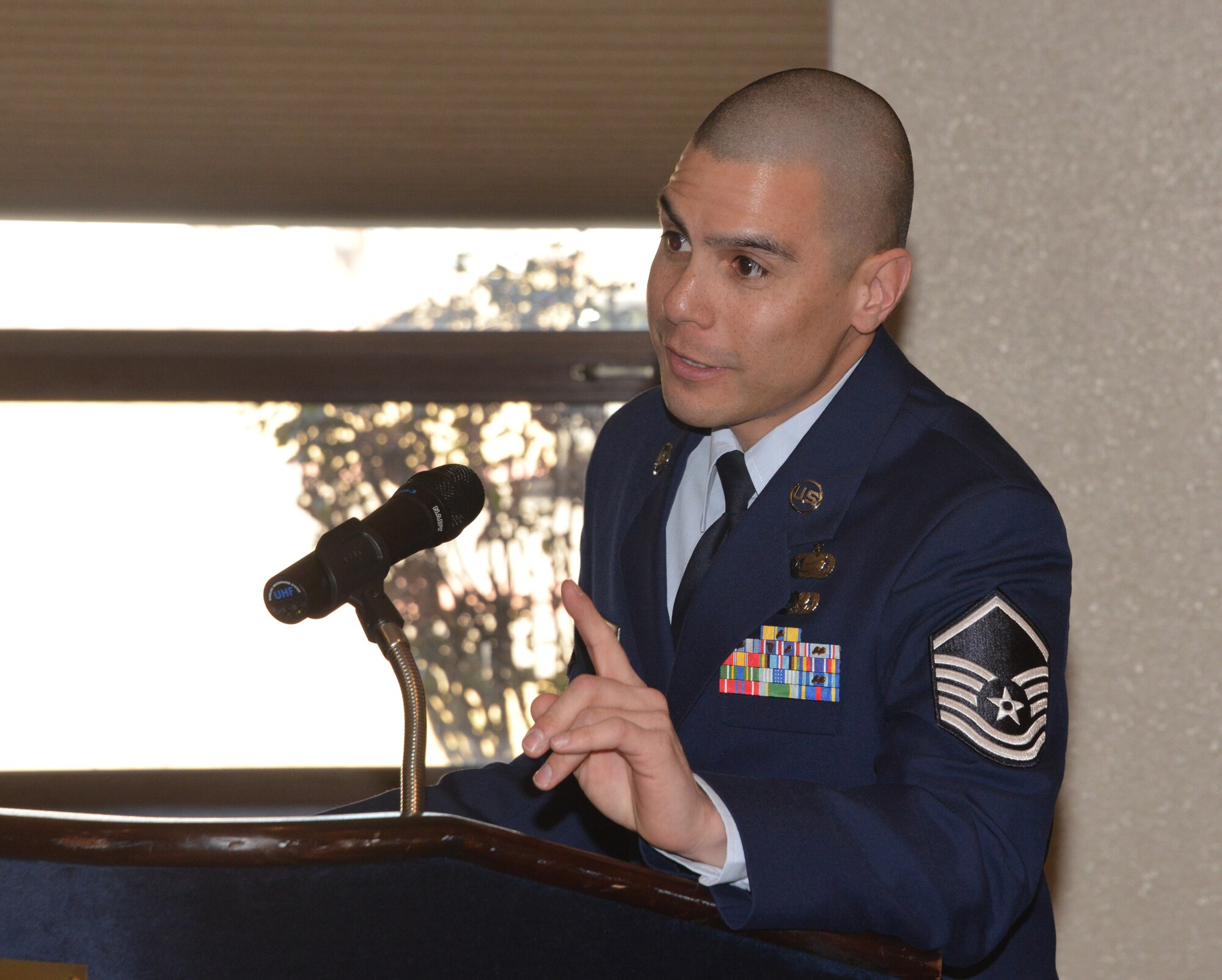 Master Sgt. Benito Rodriguez, 377th Security Forces Group training manager and president of the local AFSA chapter, speaks to an audience about the purpose of the Sergeant's Association and the importance of being a member.  AFSA is a non-profit organization representing the professional and personal interests of active, retired and veteran enlisted members of the Air Force and their families. (Photo by Dennis Carlson)