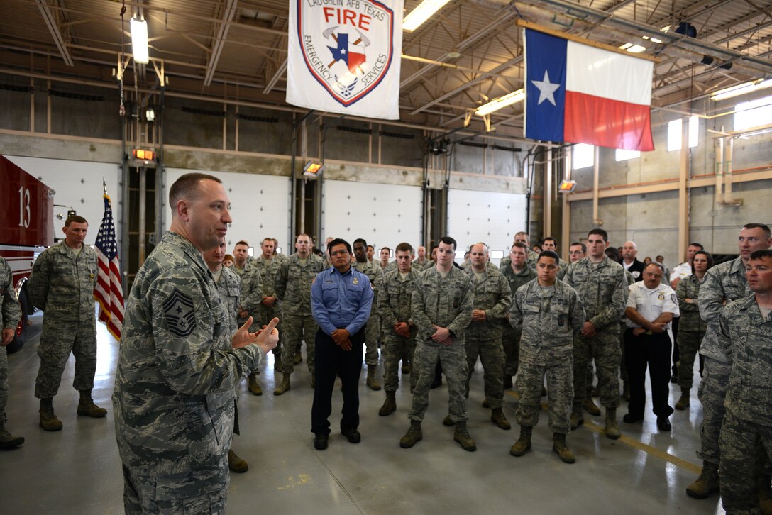 Chief Master Sergeant Robert Boyer, Command Chief Master Sergeant, 19th Air Force, JBSA-Randolph, speaks with Airmen at the Laughlin Air Force Base fire department on Laughlin Air Force Base, Texas, Feb. 24, 2015. Boyer’s two-day  visit included  breakfast with enlisted Airmen, lunch with Laughlin superintendents and first sergeants, mission briefs with Laughlin leadership and site visits to 18 base agencies. Boyer is a key advisor to the 19th Air Force commanders and senior staff on all matters affecting training, education, readiness, and effective utilization of resources in the execution of the 19th Air Force mission. (U.S. Air Force photo by Staff Sgt. Steven R. Doty)(Released)