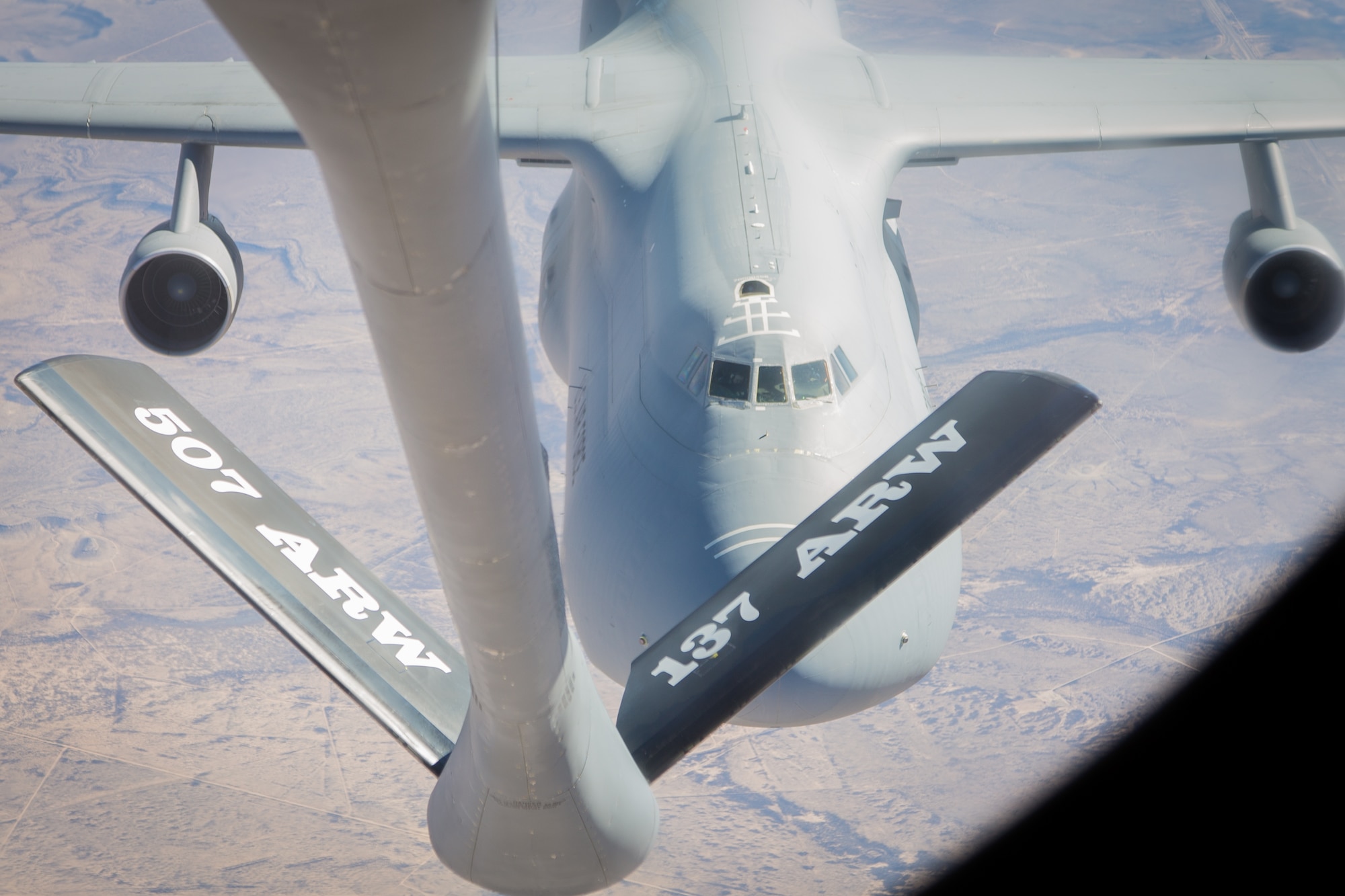 A C-5 Galaxy slowly climbs to receive fuel from a 507th Air Refueling Wing KC-135R and 465th Air Refueling Squadron aircrew on a spouse orientation flight Feb 7. (Courtesy Photo/Gayle Robbins)