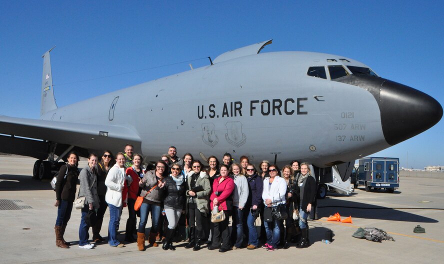A group of 465th Air Refueling Wing Spouses pose for a picture in front of a KC-135R Stratotanker after a local training flight Feb. 7. (U.S. Air Force Photo/Maj. Jon Quinlan)