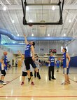 MINOT AIR FORCE BASE, N.D. -- A Special Olympics athlete goes up for a lay-up during the regional basketball tournament at the McAdoo Fitness Center on Minot Air Force Base, N.D., Feb. 21, 2015. The tournament was a stepping stone to the state-level competition, which will be held next month in downtown Minot. (U.S. Air Force photo/Senior Airman Kristoffer Kaubisch)
