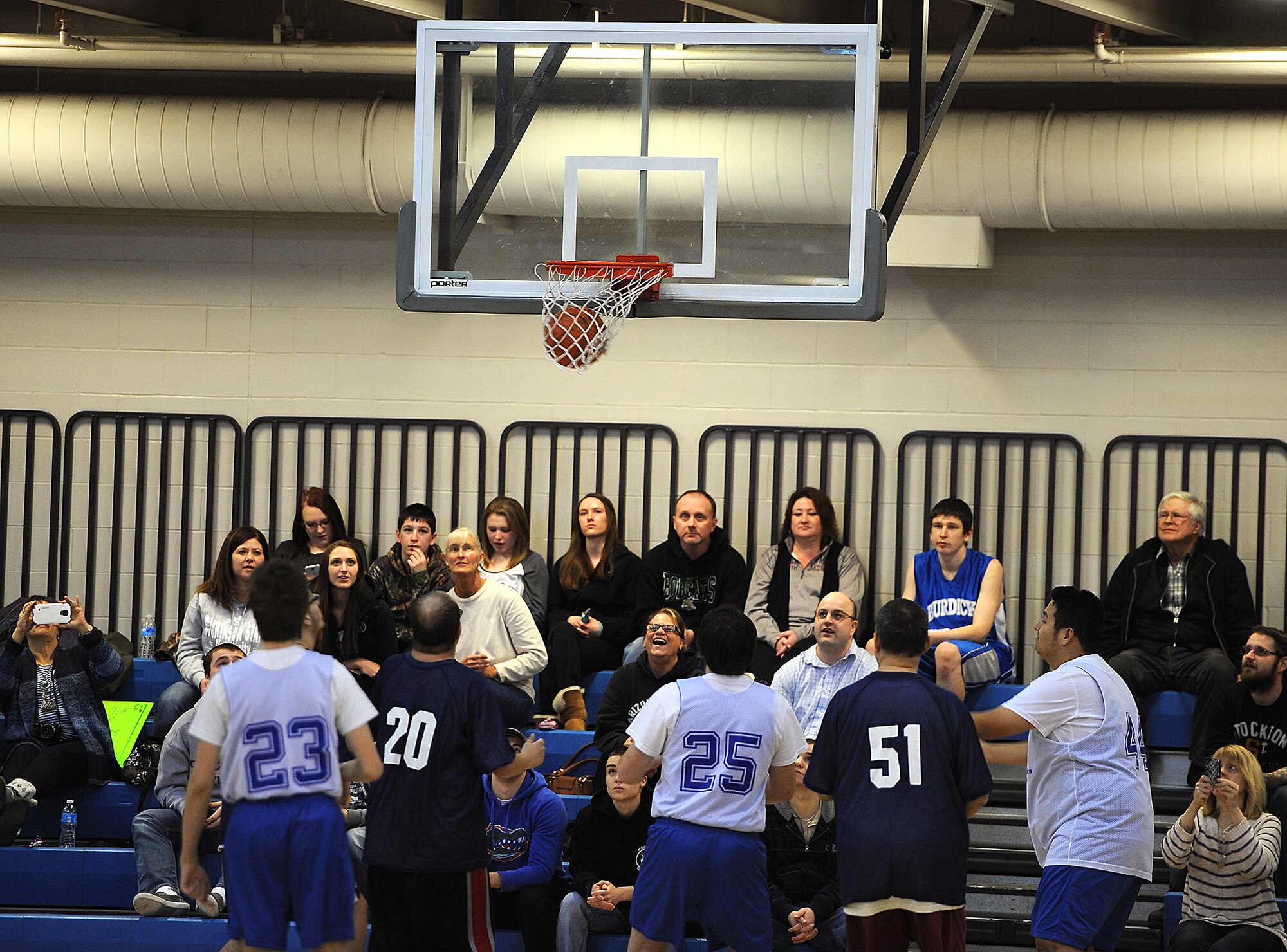 MINOT AIR FORCE BASE, N.D. -- Airmen from Minot Air Force Base teams up with Special Olympics Saturday to host a regional basketball tournament at the McAdoo Fitness Center on Minot Air Force Base, N.D., Feb. 21, 2015. The tournament was a stepping stone to the state-level competition, which will be held next month in downtown Minot. (U.S. Air Force photo/Senior Airman Kristoffer Kaubisch) 