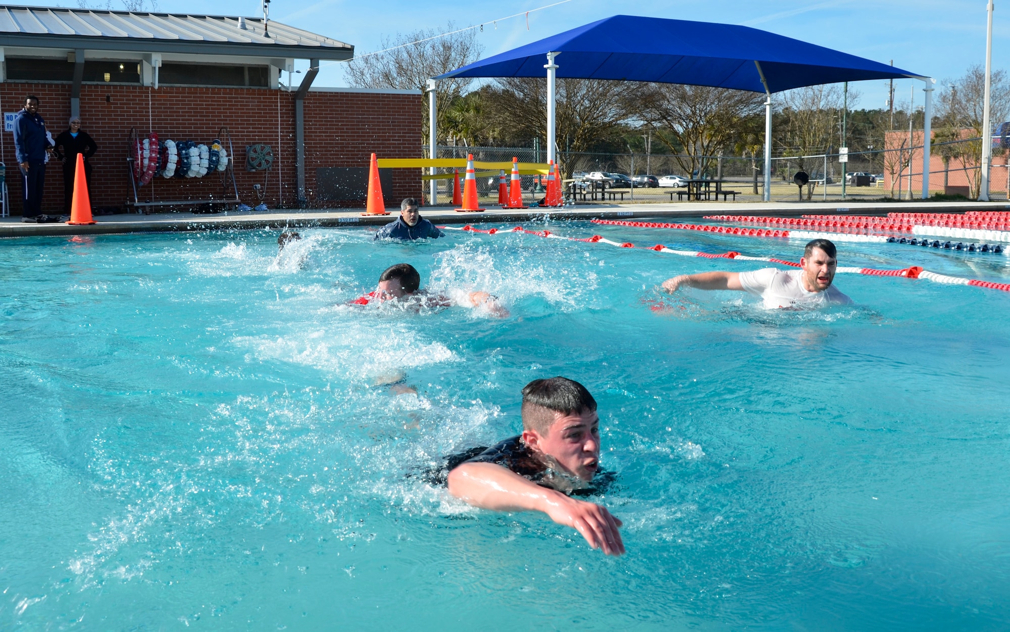 Participants swim across the New Wave Aquatic Center pool at Sam's Fitness Center on Joint Base Charleston-Weapons Station, Feb. 21, 2015 to cross the finish line of the 5K Fun Run and Polar Plunge. There were approximately 20 participants in the Sam's Fitness Center inaugural Fun Run and Polar Plunge. The temperature for the day was in the low to mid 60s. (Courtesy photo/Jessica Donnelly)
