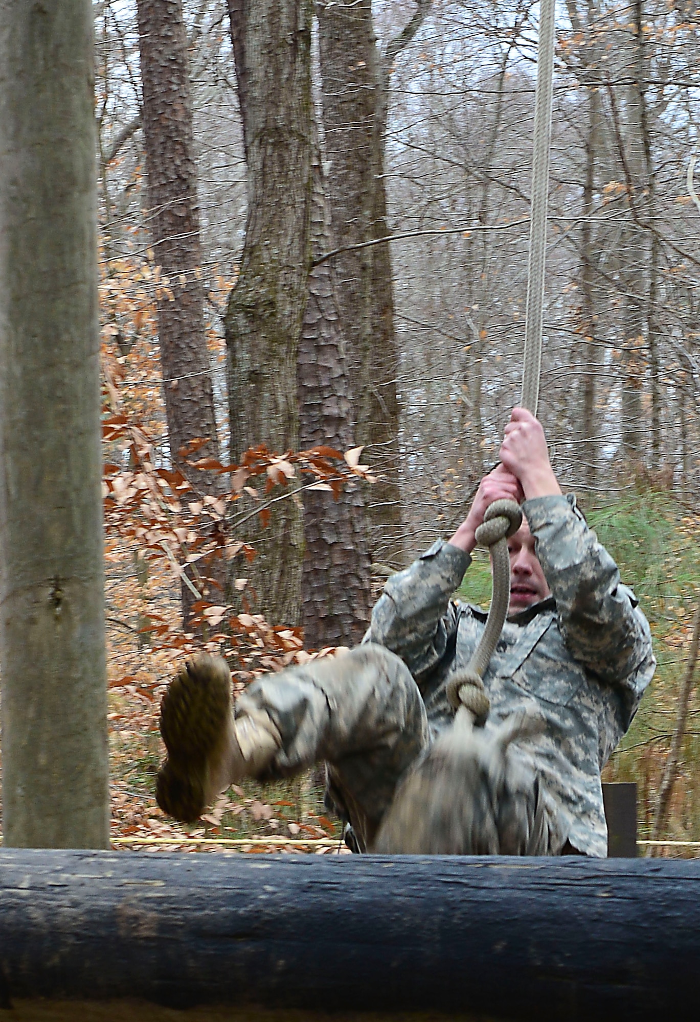 U.S. Army Staff Sgt. Brandan Beiermann, Bravo Company, 2nd Battalion, 210th Aviation Regiment, 128th Aviation Brigade, UH-60 Blackhawk maintenance instructor, completes an obstacle at the confidence course at Fort Eustis, Va., Feb. 12, 2015. The course was part of the annual 128th Avn. Bde. noncommissioned officer and Advanced Individual Training Platoon sergeant competition. (U.S. Air Force photo by Senior Airman Kimberly/Nagle/Released)
