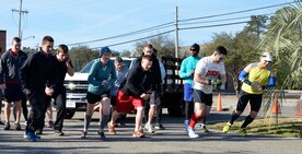 Participants prepare to start the run portion of the inaugural 5K Fun Run and Polar Plunge hosted by Sam's Fitness Center on Joint Base Charleston-Weapons Station, Feb. 21, Following the run, participants then had to swim across the New Wave Aquatic Center pool at Sam's Fitness Center. The temperature for the day was in the low to mid 60s. (Courtesy photo/ Jessica Donnelly) 
