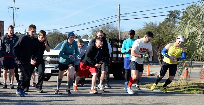 Participants prepare to start the run portion of the inaugural 5K Fun Run and Polar Plunge hosted by Sam's Fitness Center on Joint Base Charleston-Weapons Station, Feb. 21, Following the run, participants then had to swim across the New Wave Aquatic Center pool at Sam's Fitness Center. The temperature for the day was in the low to mid 60s. (Courtesy photo/ Jessica Donnelly) 
